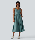 Robe midi fluide sans manches dos croisé ouvert avec poches