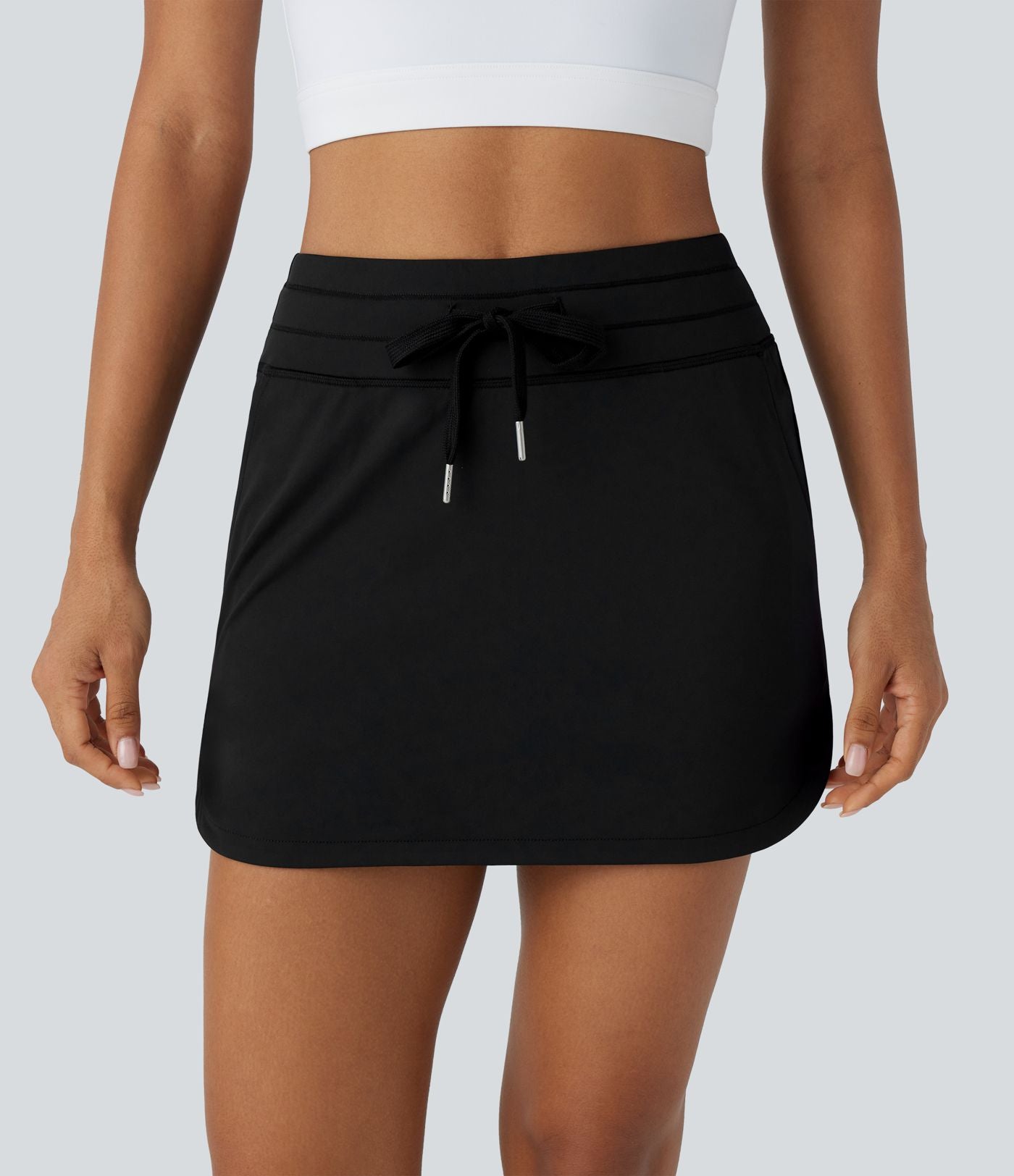 Softlyzero™ QuickDry Jupe de golf courte deux-en-un à taille haute avec poches latérales, ourlet arrondi, cordon de serrage - Poche pour tee de golf