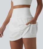Jupe de golf 2-en-1 taille ultra haute ventre plat avec ourlet arrondi et poches