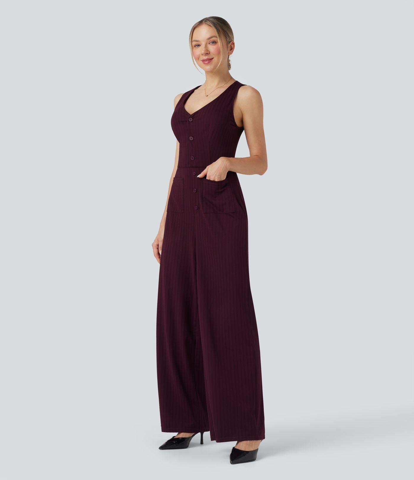 Combinaison tailleur rayée à jambes larges, décolleté en V, découpe et poches