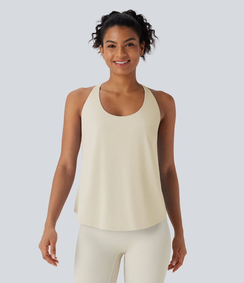Débardeur yoga dos nu col U avec bretelles croisées, ourlet arrondi et effet frais InstantCool, protection solaire UPF50+