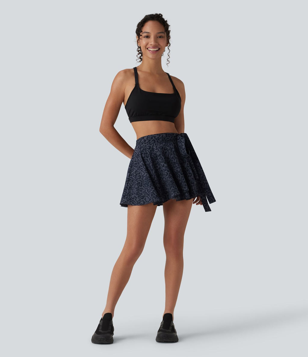 Jupe tennis mini fluide 2-en-1 taille haute imprimé léopard avec liens latéraux et poche
