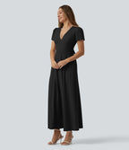 Robe mariage maxi fluide col V à manches courtes, dos nu avec lien noué et brassière intégrée