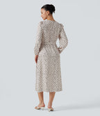 Robe midi à pois esprit bureau, col V cache-cœur et manches longues