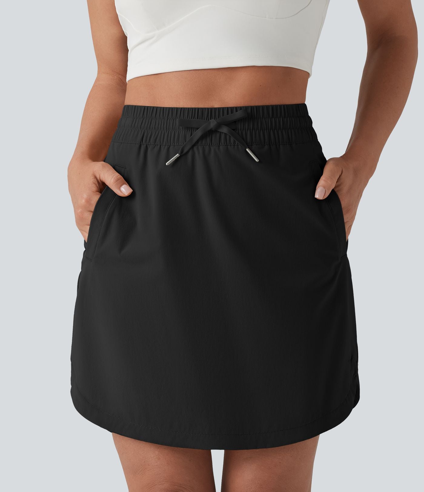 Jupe-short golf mini 2-en-1 taille haute à cordon de serrage et ourlet arrondi avec poches - Longueur plus longue