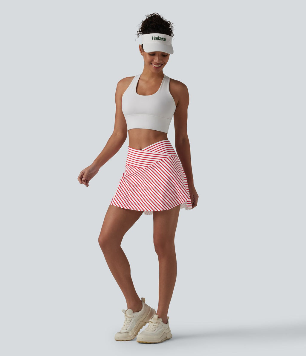 Jupe de tennis mini 2 en 1 à rayures, taille haute croisée, ourlet arrondi et poches