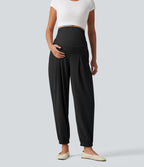 Pantalon de grossesse fuselé taille très haute en tissu gaufré avec poches