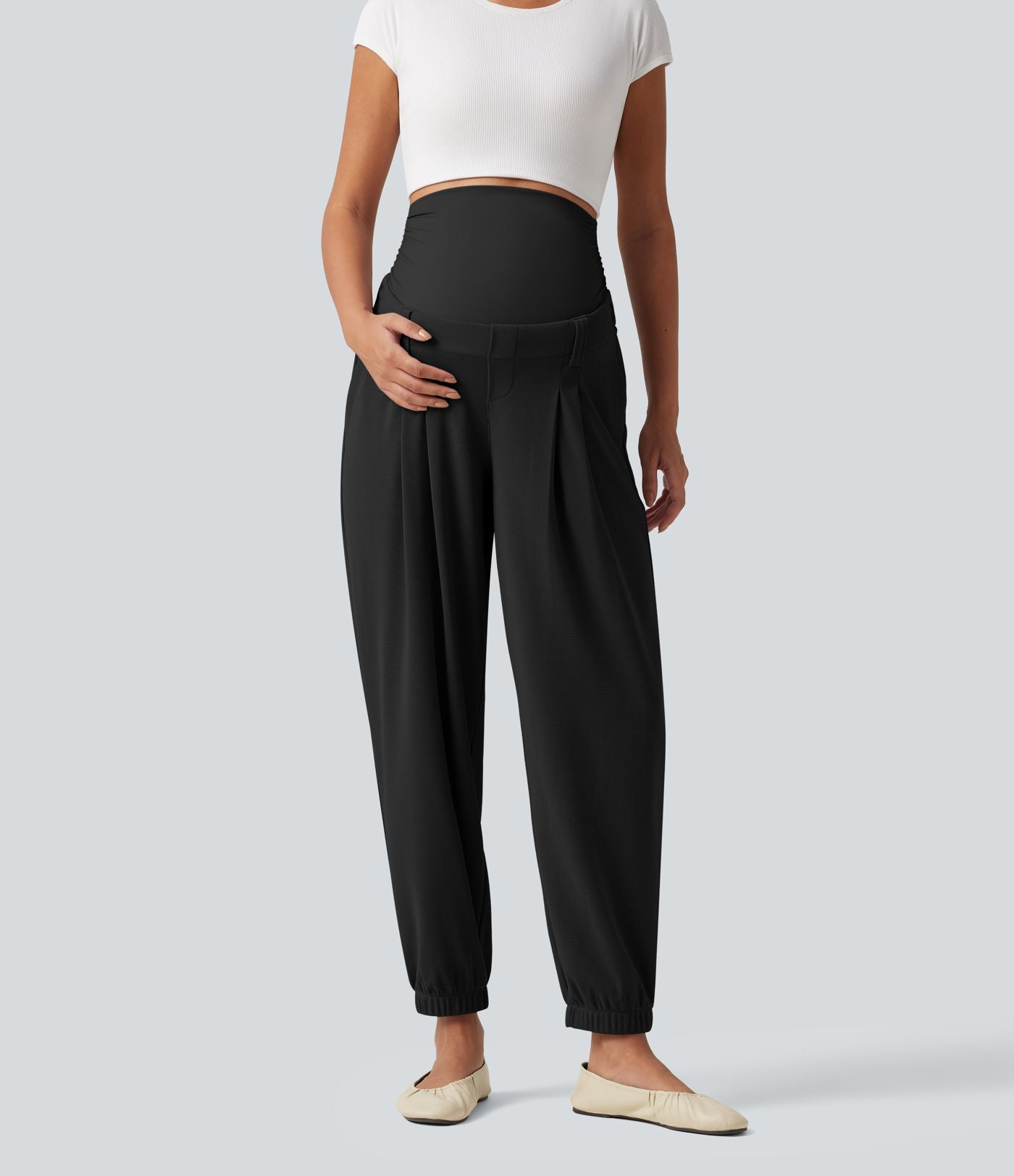 Pantalon de grossesse fuselé taille très haute en tissu gaufré avec poches