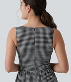 Robe longue fluide casual aspect lin col bateau sans manches à carreaux avec poches