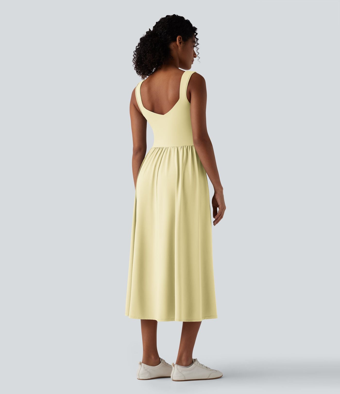 Robe midi fluide sans manches dos croisé ouvert avec poches