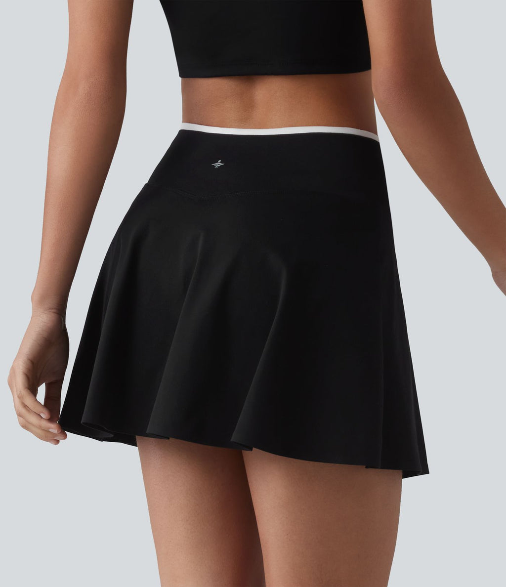 Jupe de tennis mini 2-en-1 color block croisée taille mi-haute avec poches