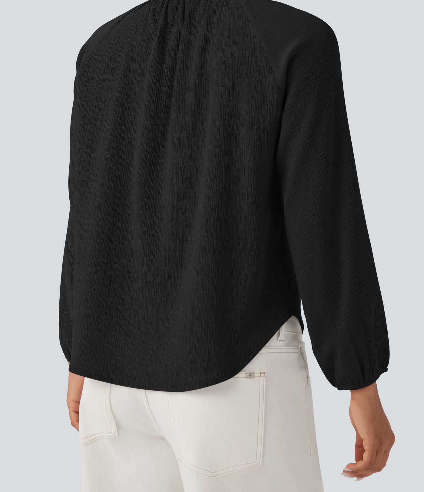 Blouse texturée col rond manches longues ourlet arrondi