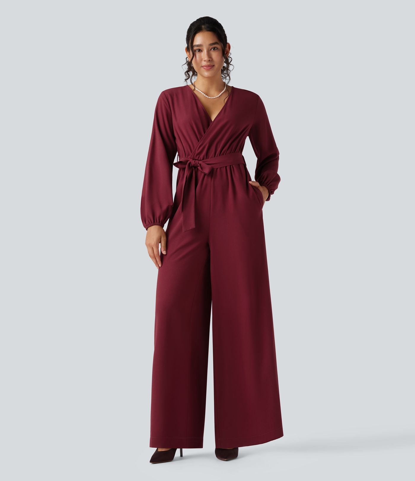 Combinaison pantalon de soirée large à décolleté en V, manches longues bouffantes, ceinture et poches