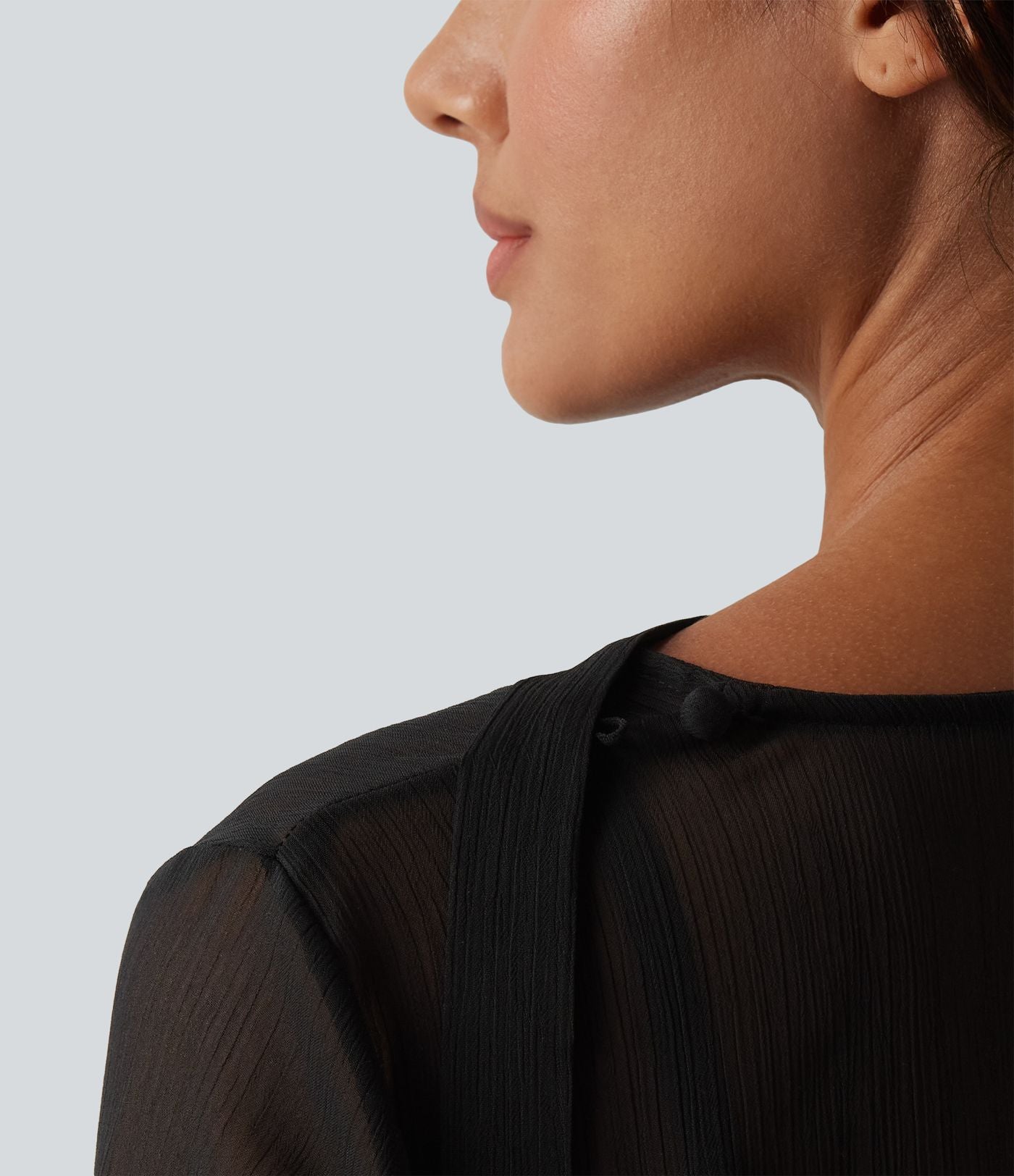 Chemise casual transparente col V manches longues à volants