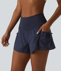 Short de sport ample 2 en 1 taille haute avec poches