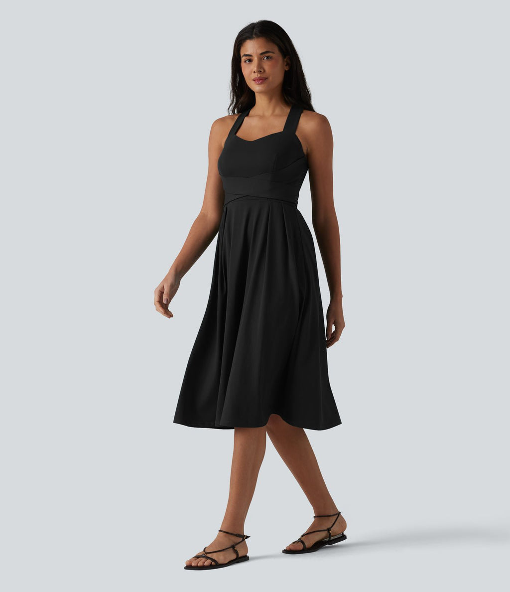Robe midi fluide sans manches décolleté cœur avec bretelles croisées, nœud dans le dos et poches