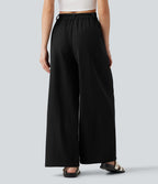 Pantalon tailleur large, taille moyenne, à poches