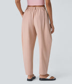 Pantalon tailleur ample, taille moyenne, coupe barrel, à poches