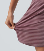Jupe de golf mini moulante 2-en-1 taille haute à rayures à poches — longueur prolongée