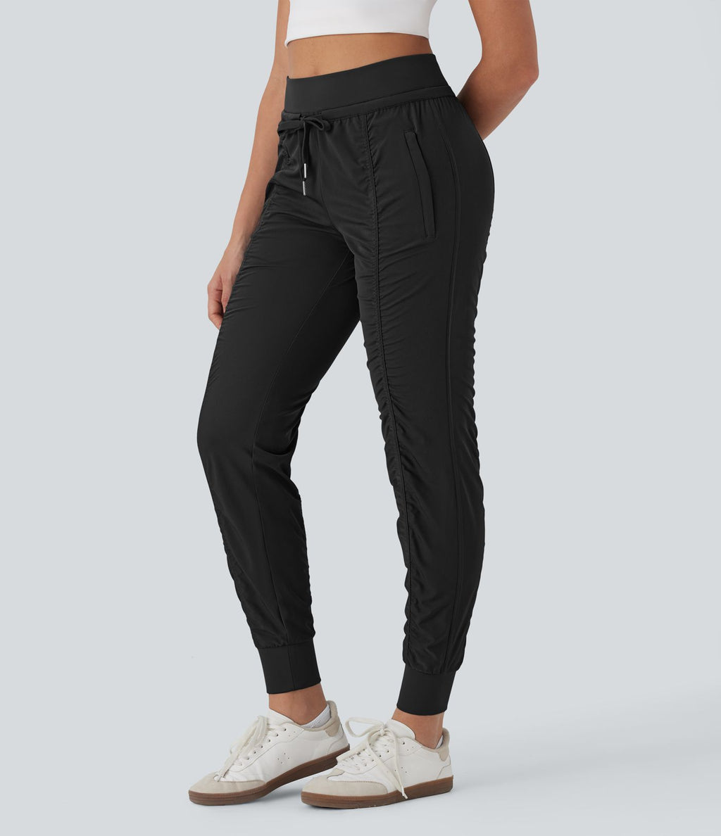 Pantalon jogging de voyage taille haute avec cordon de serrage, coupe fuselée et poches latérales zippées