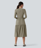 Robe tailleur mi-longue col rond manches longues ourlet à volants étagés