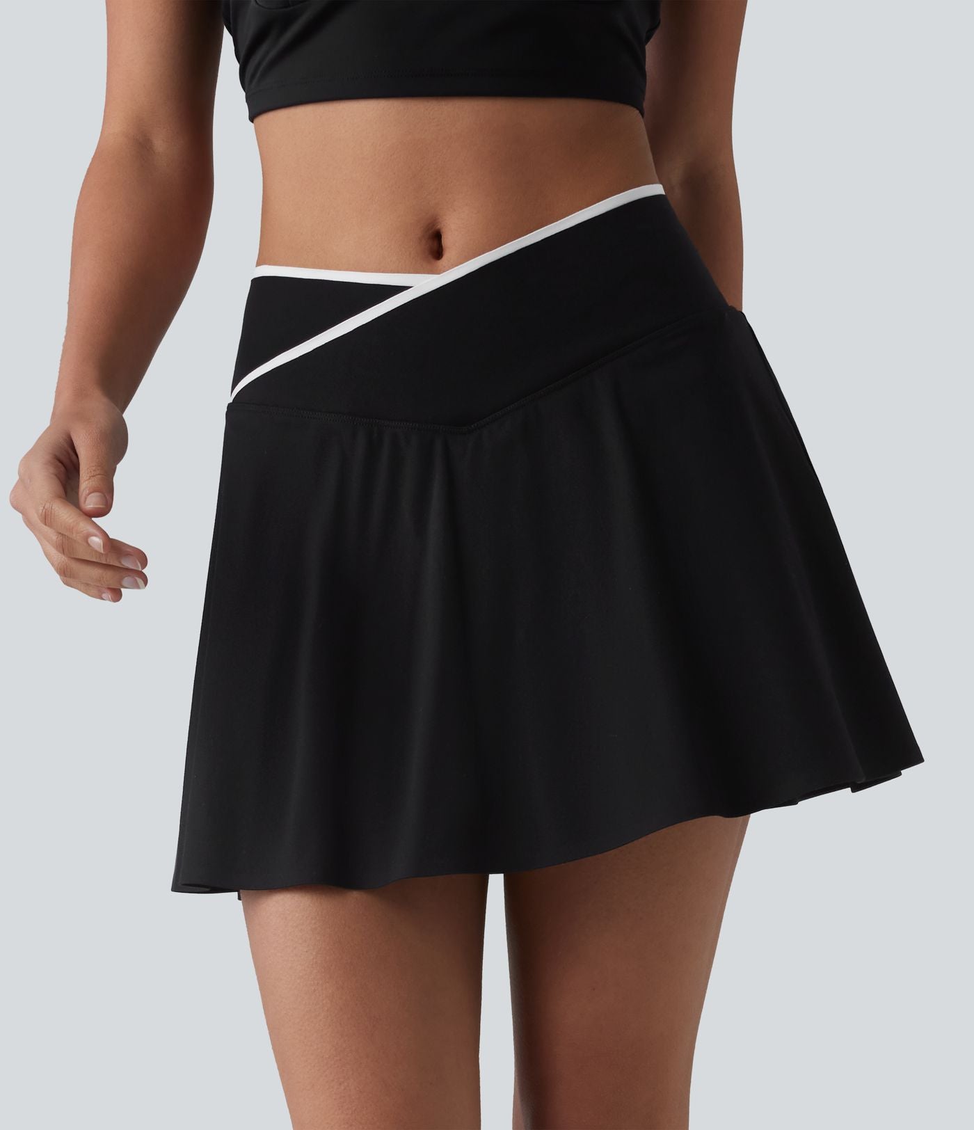 Jupe de tennis mini 2-en-1 color block croisée taille mi-haute avec poches