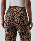 Pantalon tailleur fuselé asymétrique taille mi-haute gaufré imprimé léopard avec poches