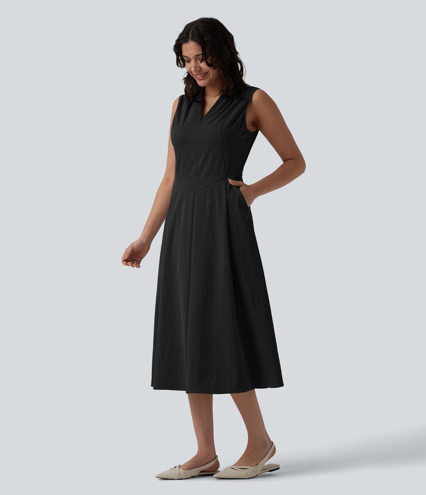 Robe mi-longue plissée col V sans manches avec fermeture éclair invisible et poches pour le travail