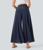 Pantalon fluide et ample avec superposition en mesh, poches latérales et taille haute