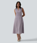 Robe mi-longue plissée col V sans manches avec fermeture éclair invisible et poches pour le travail