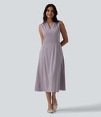 Robe mi-longue plissée col V sans manches avec fermeture éclair invisible et poches pour le travail
