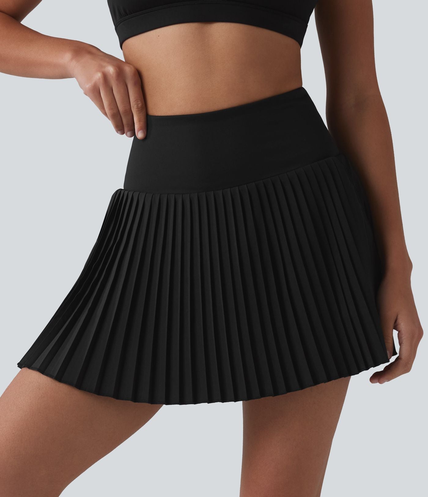 Breezeful™ Jupe mini de tennis plissée 2 en 1 taille haute séchage rapide avec poches