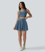 Jupe mini fluide évasée 2-en-1 taille haute à cordon, empiècements en mesh contrastant, avec poche, version plus longue