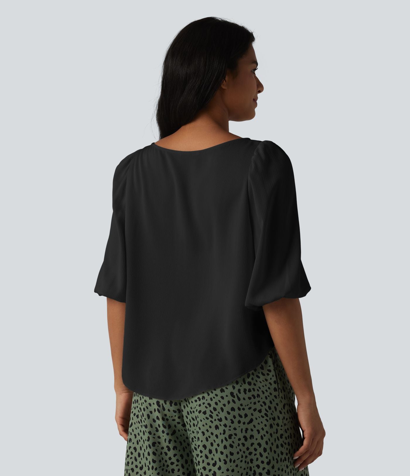Blouse décontractée à manches bouffantes et ourlet arrondi texturé