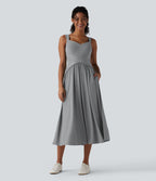 Robe midi fluide sans manches dos croisé ouvert avec poches