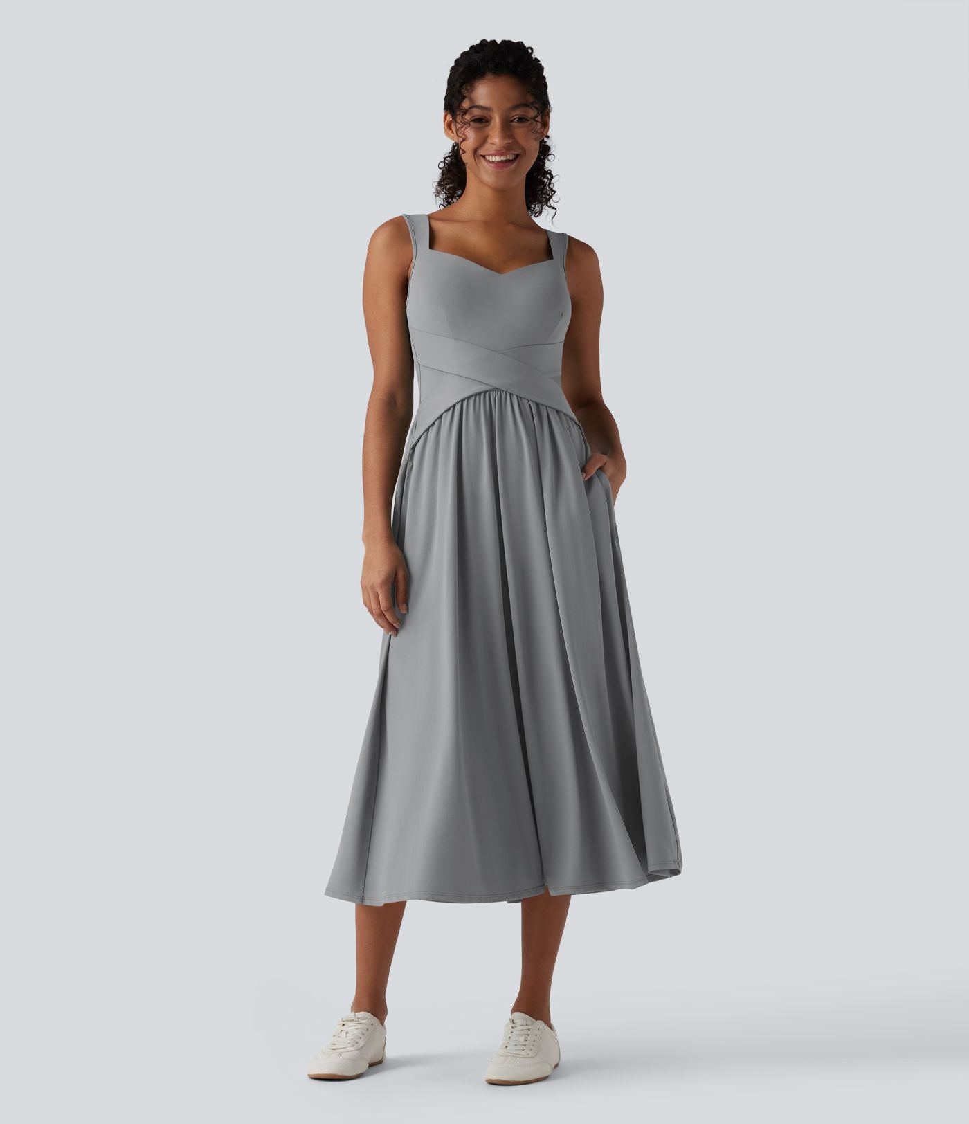 Robe midi fluide sans manches dos croisé ouvert avec poches