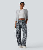 Pantalon tailleur fuselé asymétrique taille mi-haute gaufré imprimé léopard avec poches