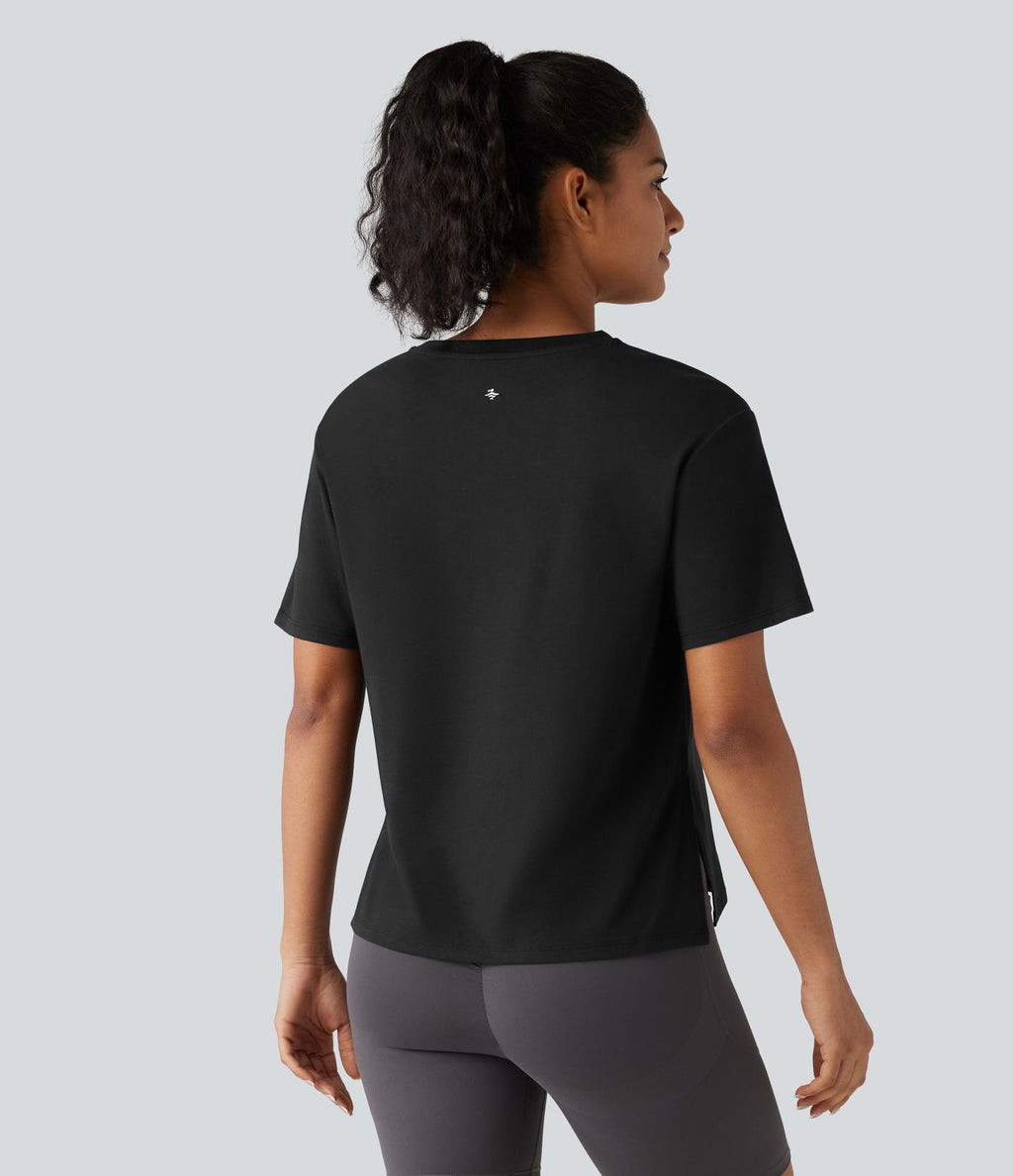 Haut de sport en coton col rond à manches courtes, ourlet fendu et coupe ample pour le yoga