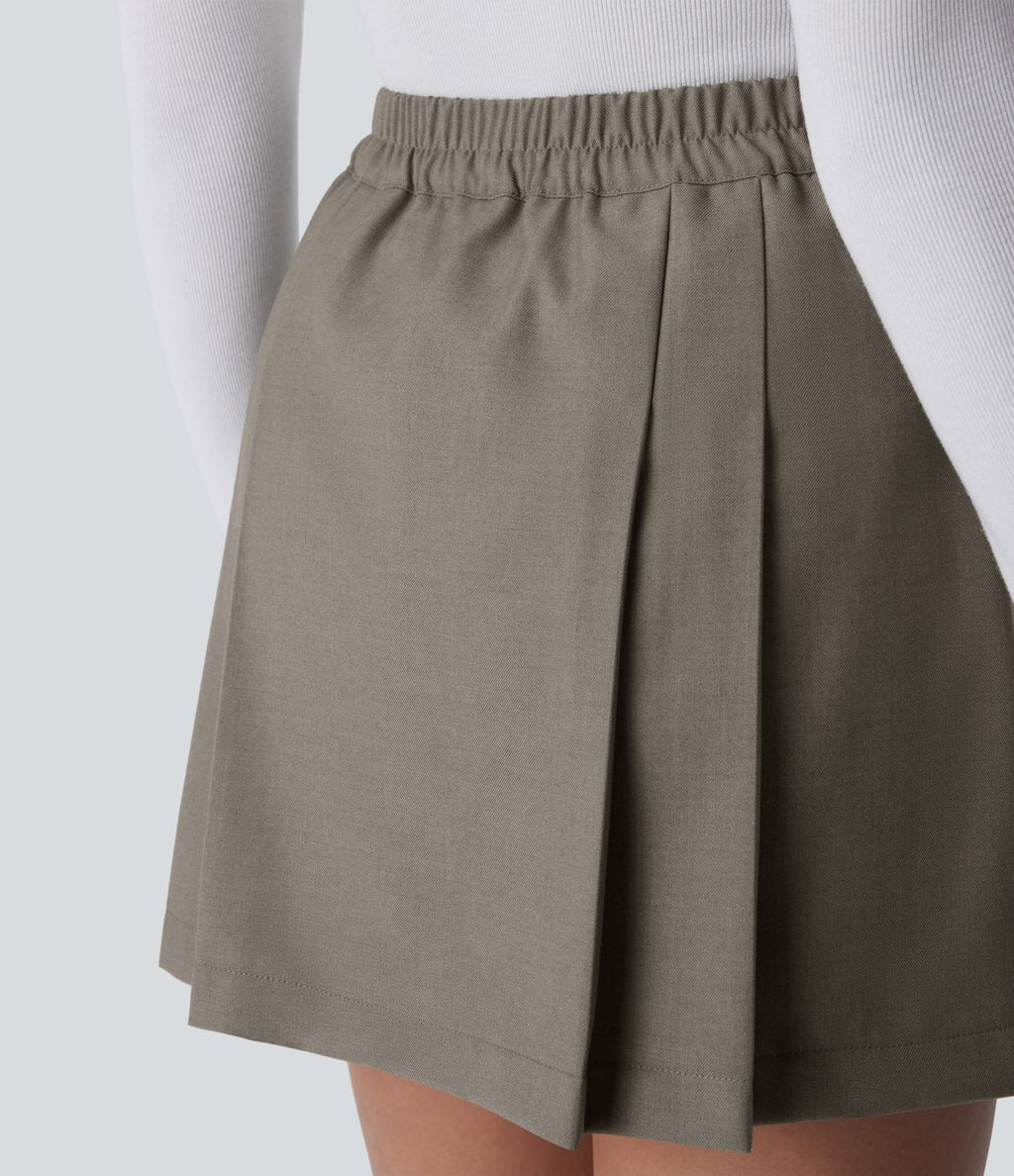 Mini-jupe plissée taille haute 2-en-1 avec fermeture éclair invisible