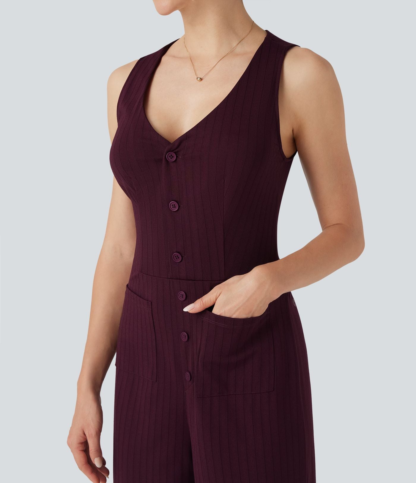 Combinaison tailleur rayée à jambes larges, décolleté en V, découpe et poches