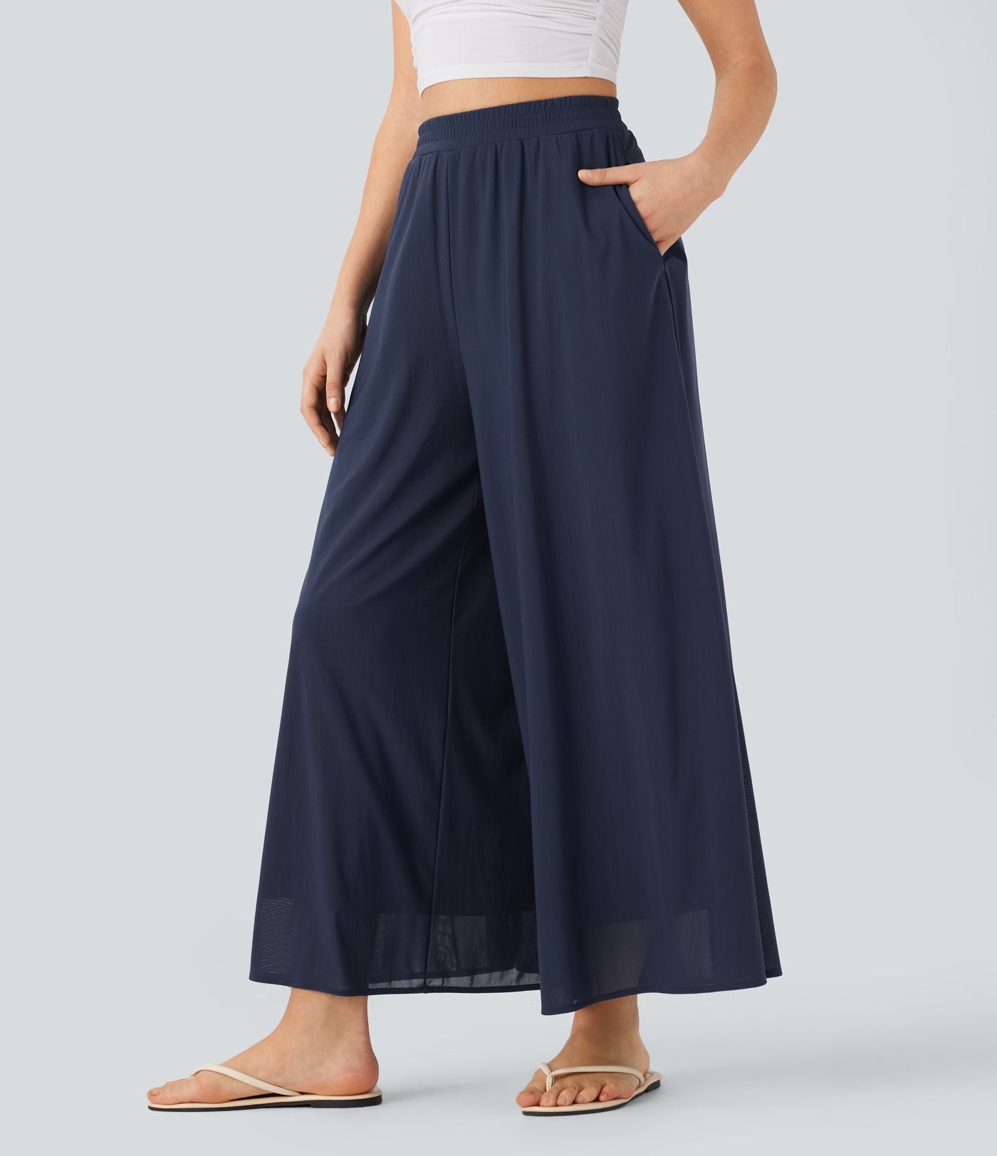 Pantalon fluide et ample avec superposition en mesh, poches latérales et taille haute
