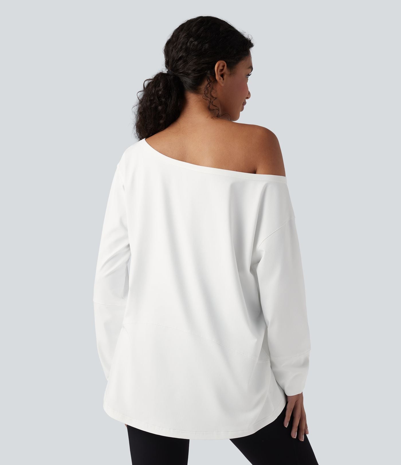 Haut de yoga ample asymétrique à manche longue