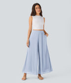 Pantalon fluide et ample avec superposition en mesh, poches latérales et taille haute