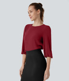 Blouse de travail col bateau avec manches évêque et dos ajouré