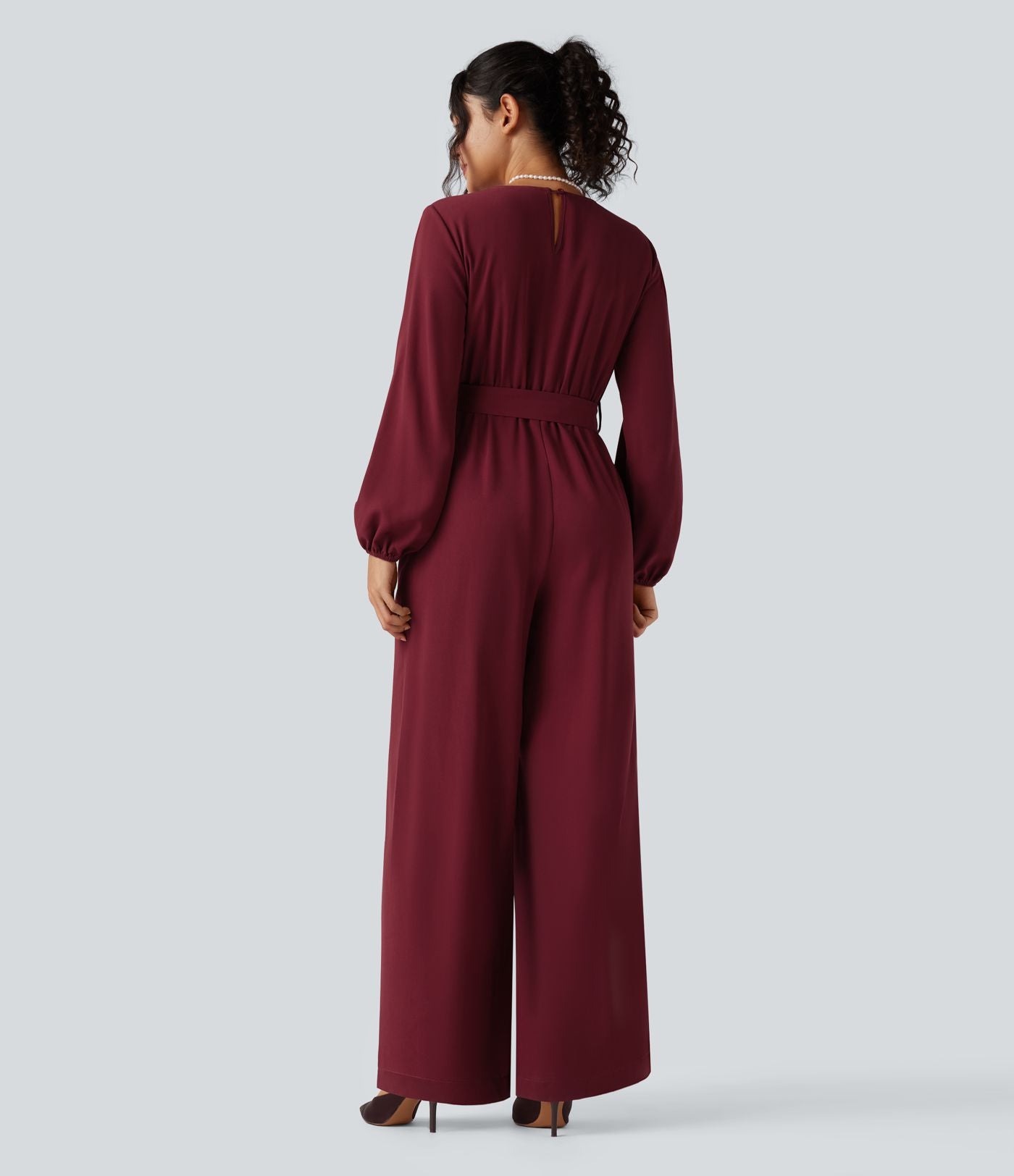 Combinaison pantalon de soirée large à décolleté en V, manches longues bouffantes, ceinture et poches
