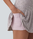 Jupe de sport mini gainante 2-en-1 taille haute à rayures avec poches