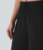 Pantalon ample décontracté à taille mi-haute, fentes, aspect lin, cordon de serrage et poches