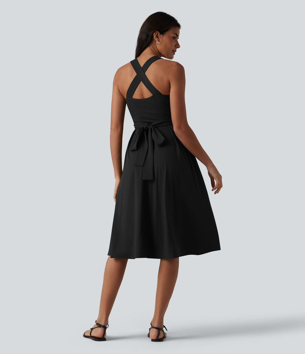 Robe midi fluide sans manches décolleté cœur avec bretelles croisées, nœud dans le dos et poches