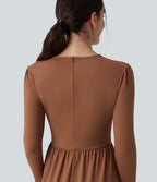 Robe tailleur mi-longue col rond manches longues ourlet à volants étagés