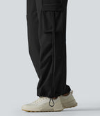 Pantalon cargo large fluide d'entraînement taille haute avec cordon de serrage, séchage rapide, à effet frais InstantCool et poches, protection solaire UPF40+